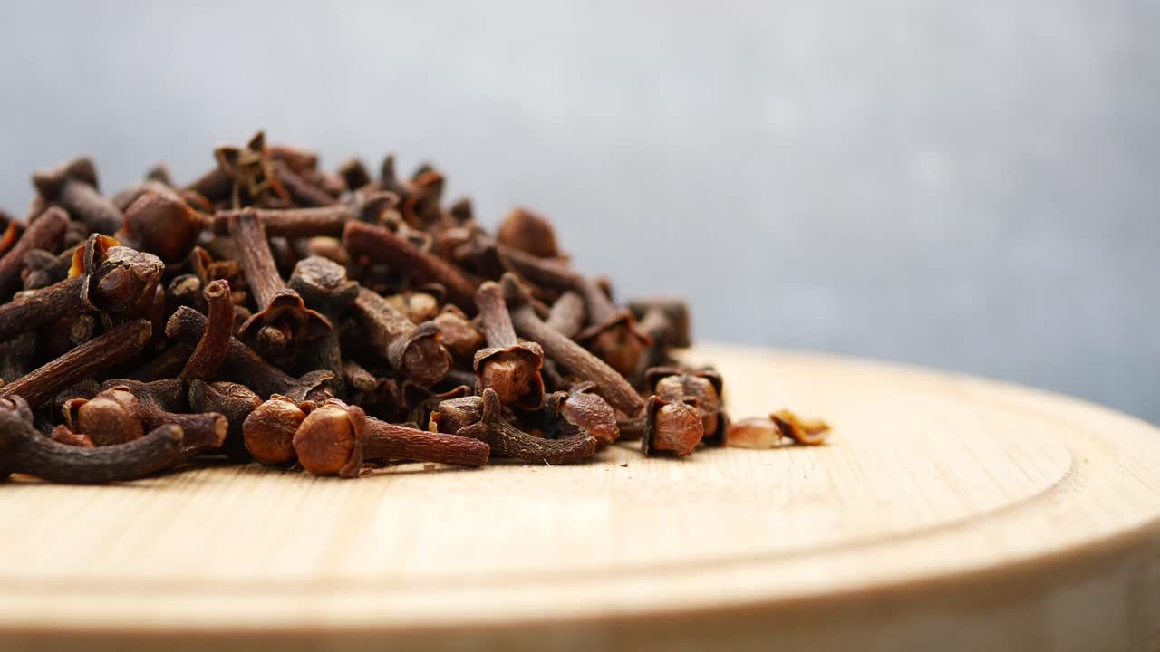 Pile of Cloves on a Wooden Surface