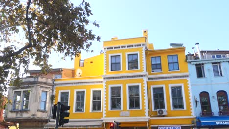 colorful yellow buildings in a city street