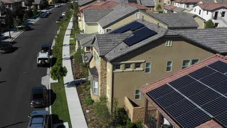 solar panels clean renewable energy system on sunny tustin house rooftop aerial view low angle orbit