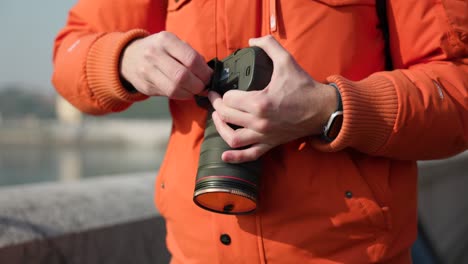 mounting metal plate on professional camera, close-up