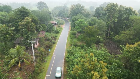 Road-Trip-Of-Vehicle-Moving-On-Rural-Road-Surrounded-With-Green-Trees-At-Rainy-Day,-Handaganawa