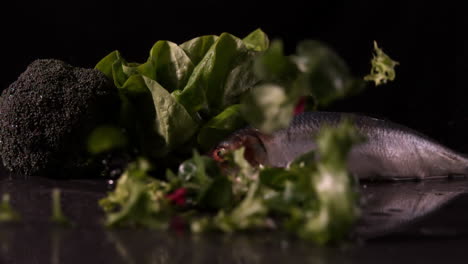 lettuce leaves falling in front of fresh trout