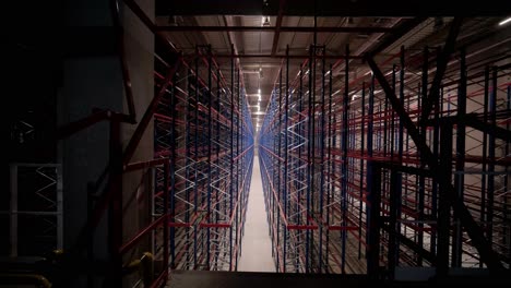 big and modern warehouse under construction, featuring metal shelving and other industrial equipment.