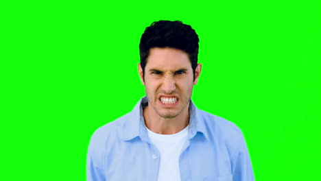 Man-growling-at-camera-angrily-on-green-screen