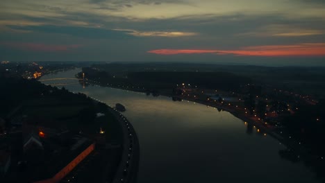 aerial view of the drava river and the city at sunset in osijek, croatia.