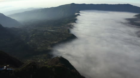 aerial view of a fog covered valley in the bromo tengger semeru national park of java, indonesia