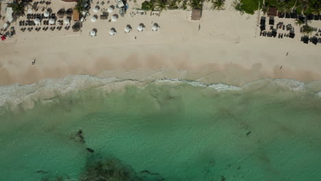 Dolly-shot-of-Tulum-Beach-shoreline-with-waves-crashing