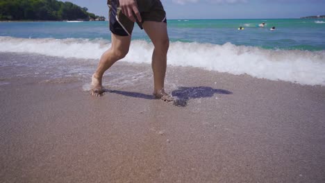 feet walking on the beach.