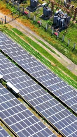 huge construction of solar electric power. big panels of ecology alternative energy. vertical video