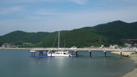 charter catamaran yacht at jetty near hanwha resort geoje belvedere, geoje island, south korea