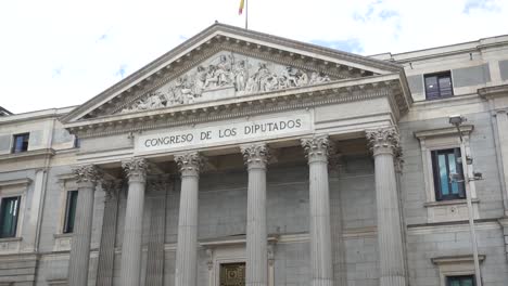 tilt reveal shot of palacio de las cortes, congress of the deputies building in madrid