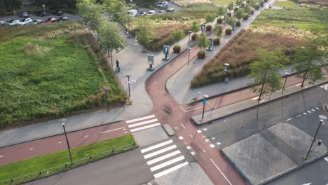 Bustling-rush-hour-activity-on-street,-cyclists-and-pedestrians,-timelapse