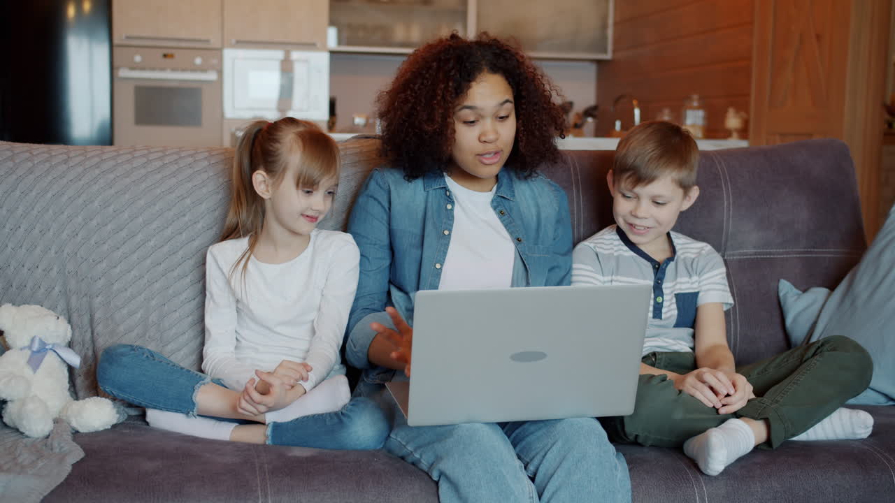 Family using laptop together at home