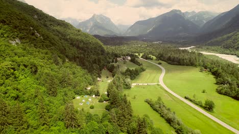 aerial view of a valley and the main street surrounded by hills in summertime.