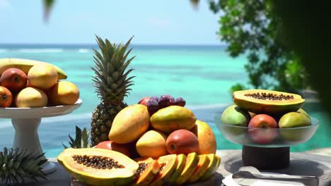 vibrant display of tropical fruits showcased against a breathtaking seaside backdrop, highlighting nature's bounty and the beauty of fresh produce