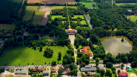 Beautiful-avenue-of-trees-of-Nieborow-Palace,-a-Baroque-style-residence-in-Poland