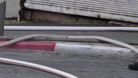 fire hose stretched on the street, professional firemen equipment in use