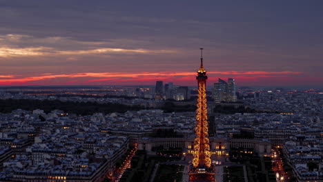 eiffel tower at sunset over paris cityscape