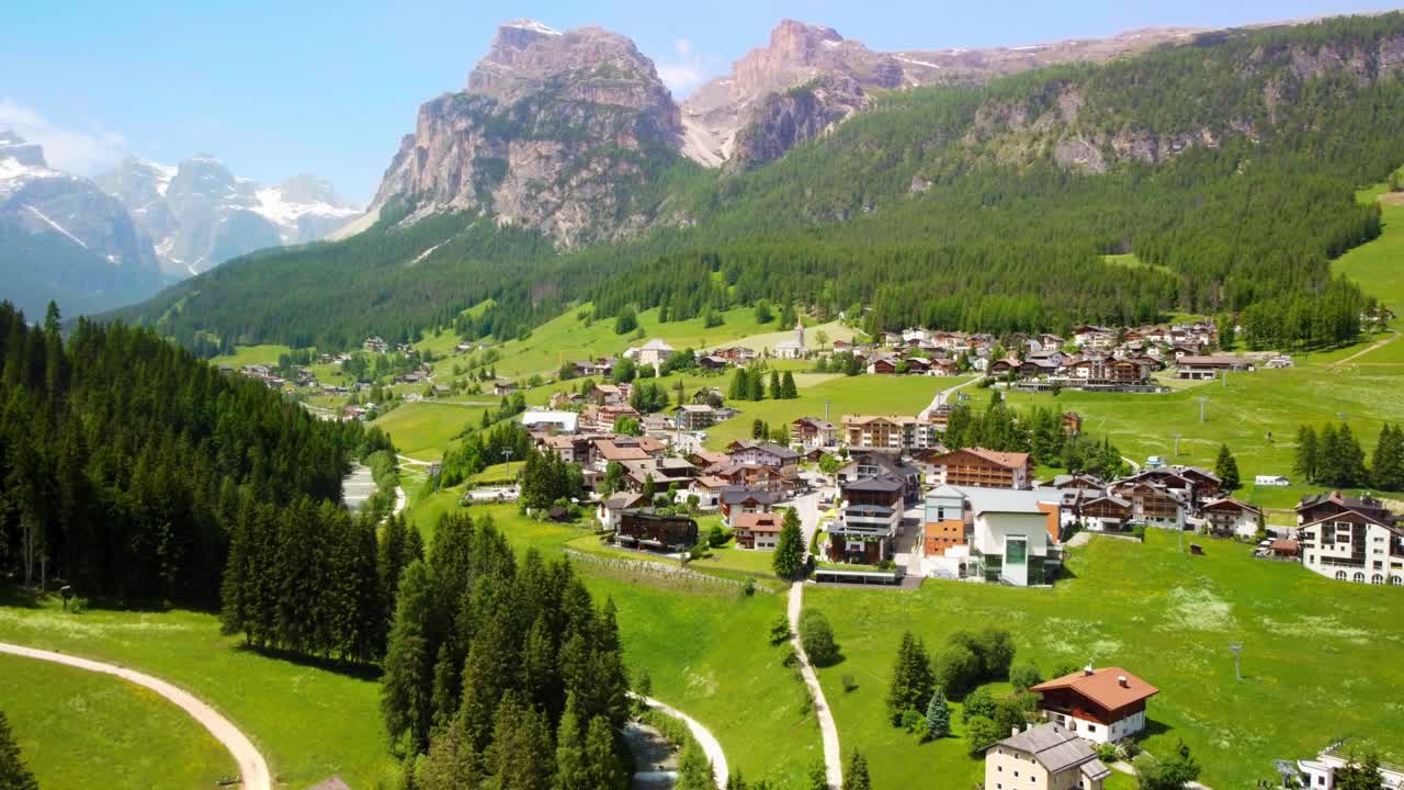 Aerial view of La Villa village in South Tyrol, Italy, showcasing local hotels and stunning mountain surroundings