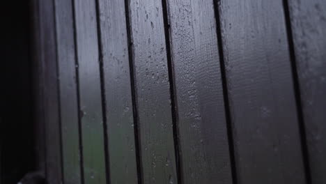 male hands knocking on wooden door in slow motion