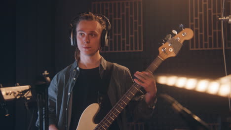 bass guitarist in recording studio
