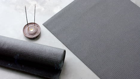 yoga mats and incense sticks creating peaceful home meditation space