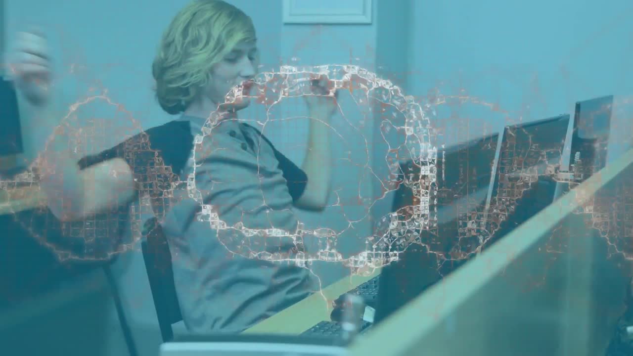 컴퓨터를 사용하여 남성 학생 위에 회전하는 인간 뇌의 애니메이션