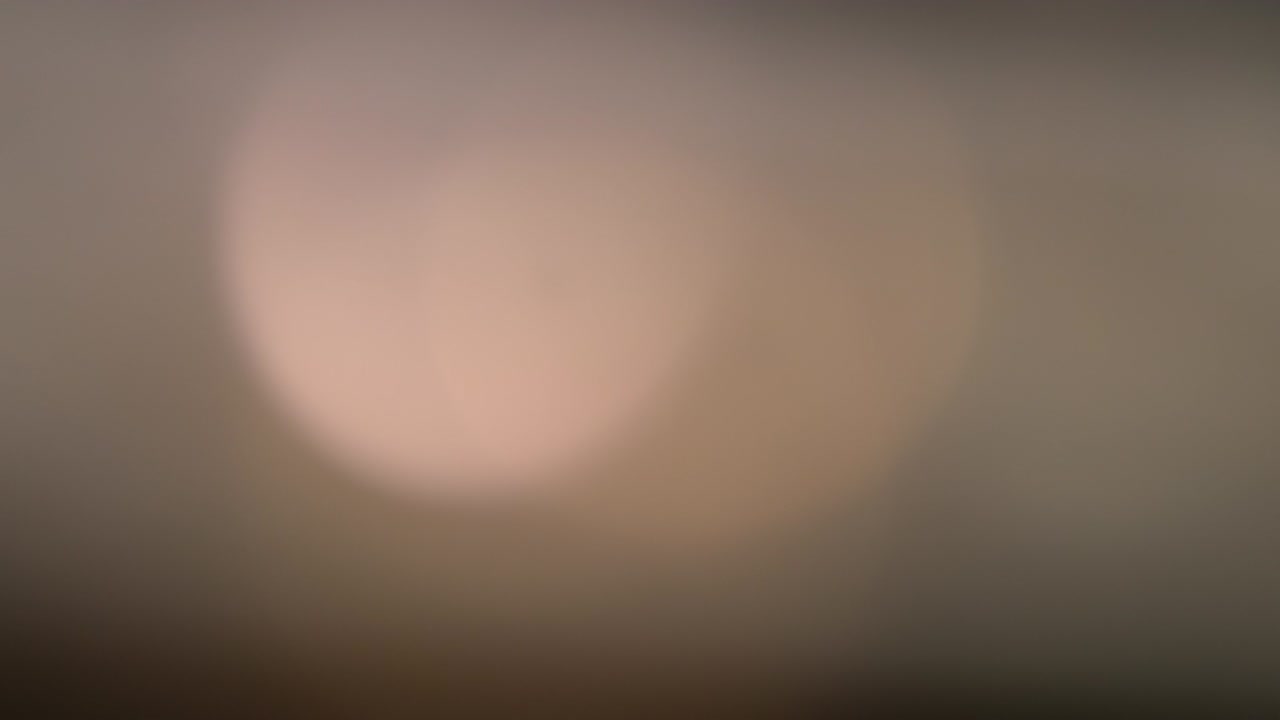 Abstract light leaks on black background.