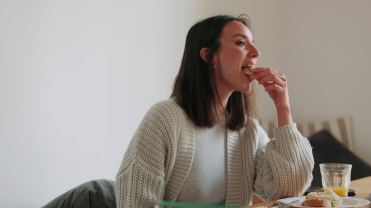 Young Woman Enjoying a Healthy Breakfast at Home