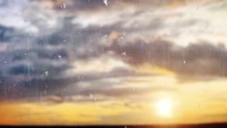 loop video. yellow sky with clouds and sun, clouds at sunrise. nobody nature landscape. drops of rain trickling down on glass. concept: visuals loop, relaxing, travel, trip. raindrop 4k stock footage