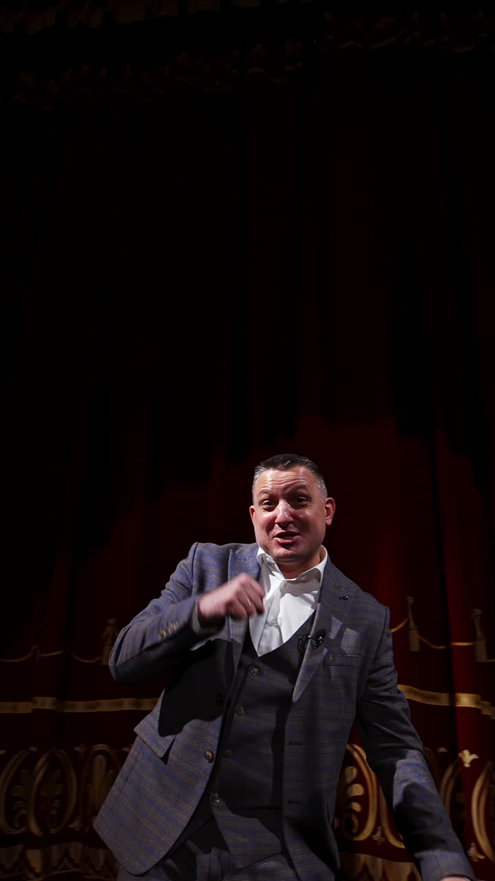 Inspirational male speaker does presentation of new technological product. Motivational Speaker. Vertical video