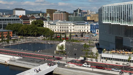 timelapse of downtown oslo, norway cityscape with busy street traffic, zoom in