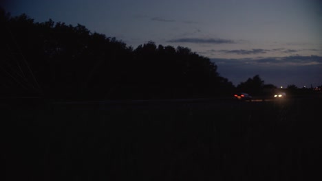 Shot-of-road-with-cars-driving-by