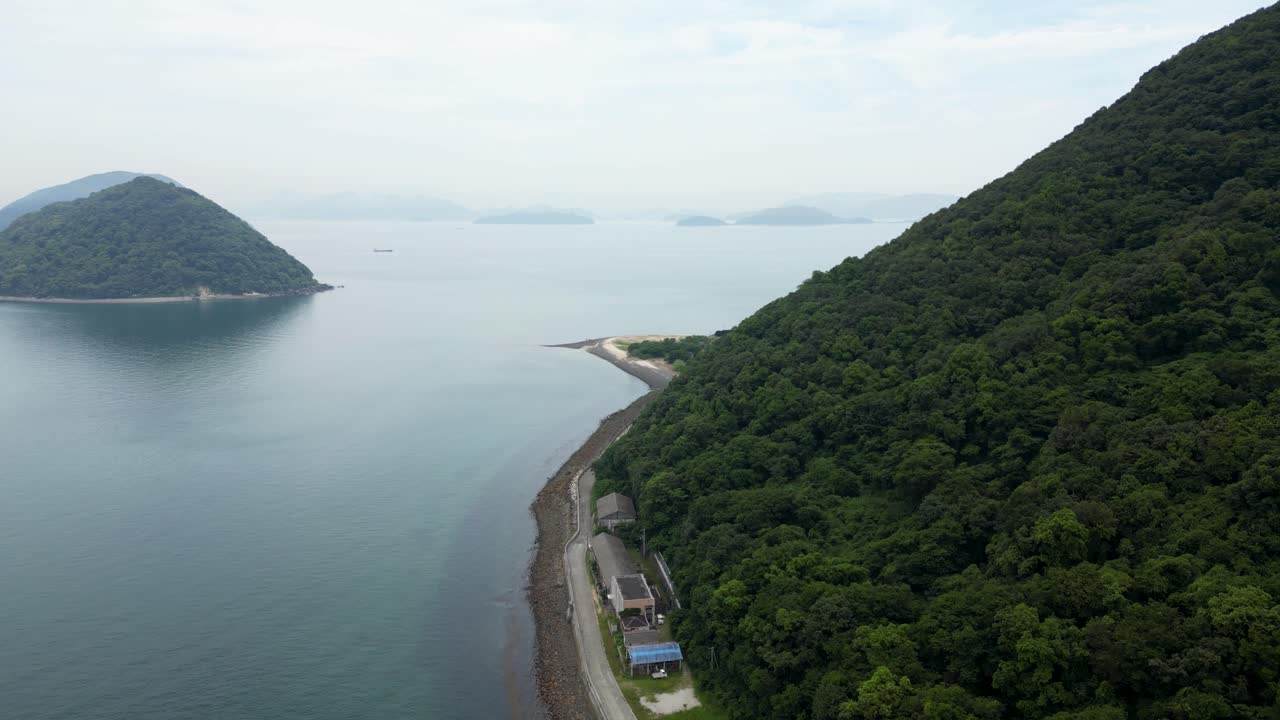 Forward flying drone view over Sanagi Cat Island in seto inland sea