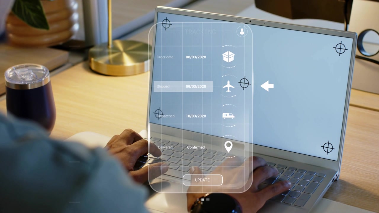 Fingers pressing keys, man typing and navigating translucent tracking overlay, updating shipment