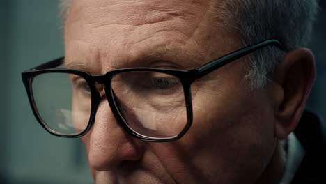 close-up of an elderly man wearing glasses