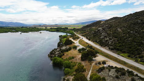 Aerial-backwards-view-of-Bendigo-with-freedom-camping-in-scenic-landscape-in-front-of-the-sea