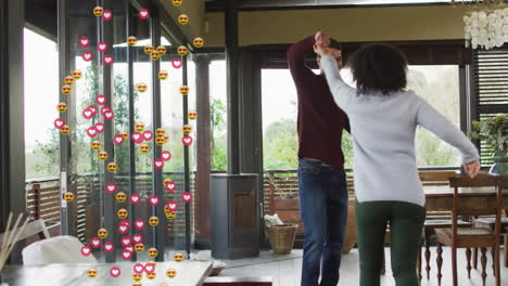 dancing couple spinning in modern living room, highlighting social media reaction icons
