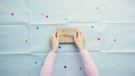 top view woman holding birthday present planning party hands from above - red epic dragon