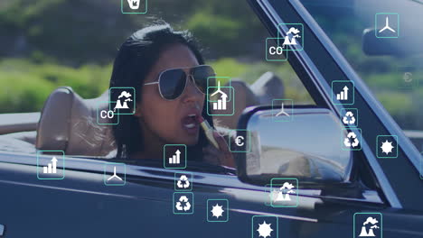 animation of eco icons over biracial woman driving car