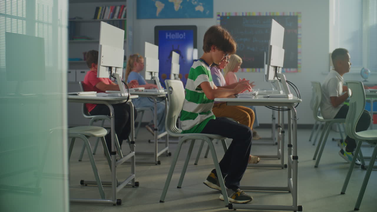Students learning with computers in the classroom