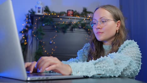 relaxed brunette typing and looking for christmas gift online