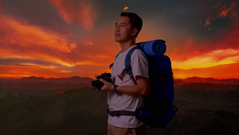photographer hiking in mountains at sunset