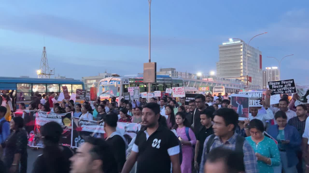 Crowd of people walking on streets demanding justice for murder of lady doctor at RG Kar hospital in Kolkata, India.