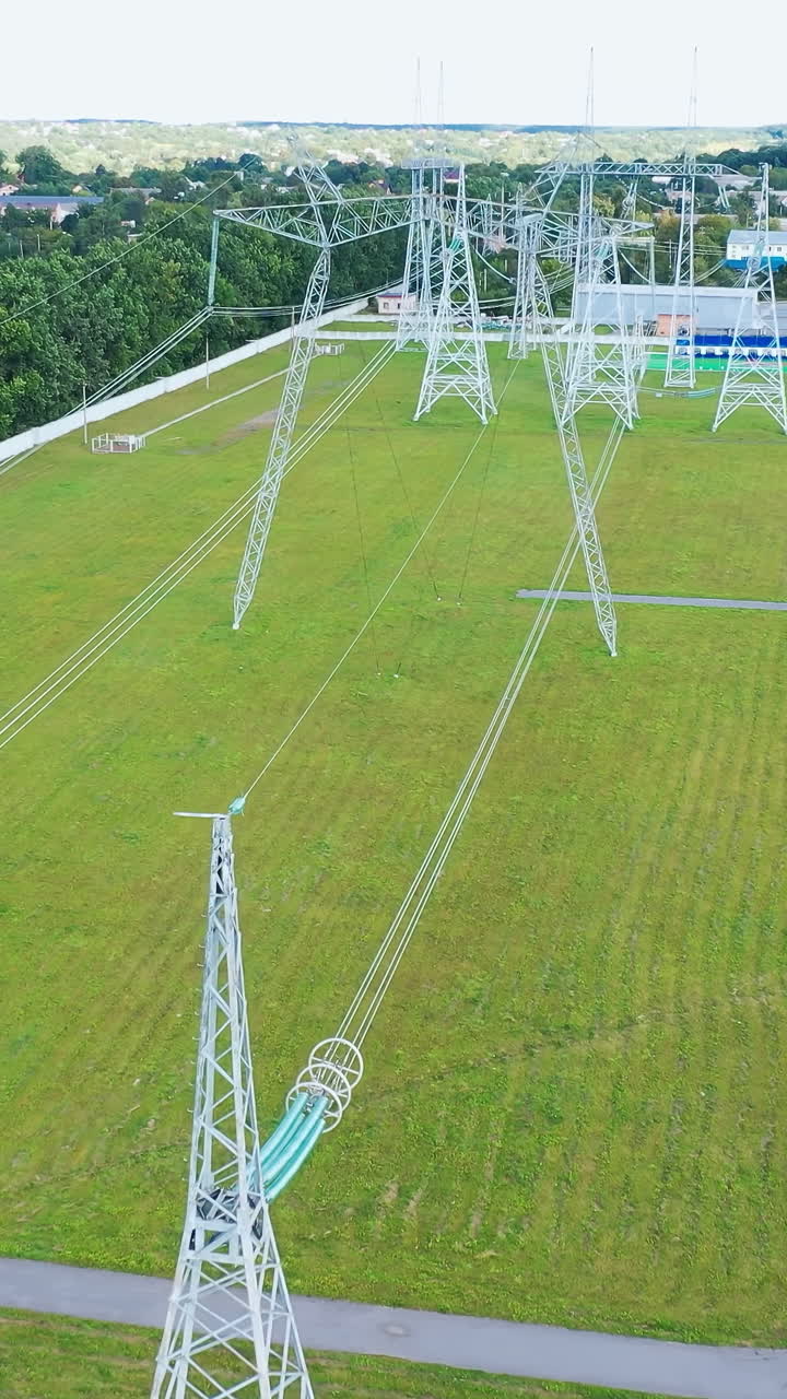Electric transformers wires and grid. Long-range energy high voltage transmission. Vertical video