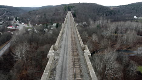 the tunkhannaock creek viaduct in nicholson, pennsylvania built by the lackawanna railroad under a cloudy fall sky