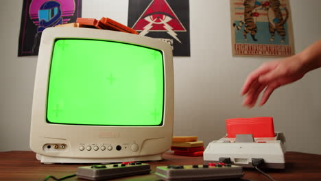 retro gaming setup with green screen tv