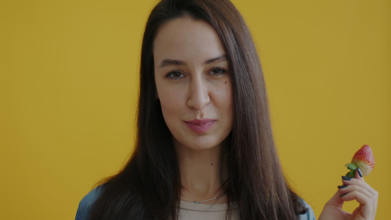 Woman Eating a Strawberry