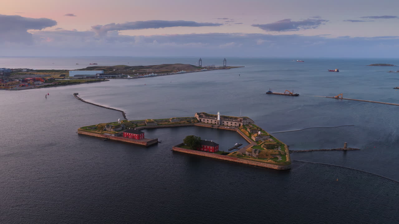 Aerial drone view of the historic Trekroner Fort with its lighthouse and old military buildings by the sea in Copenhagen, Denmark