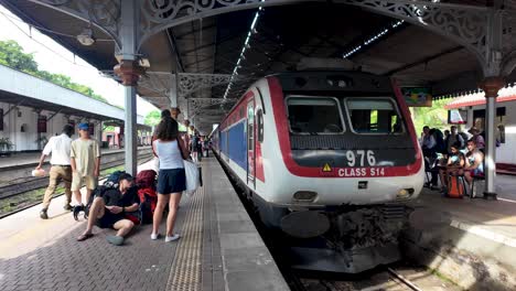 sri lankan train station: passengers waiting on platform
